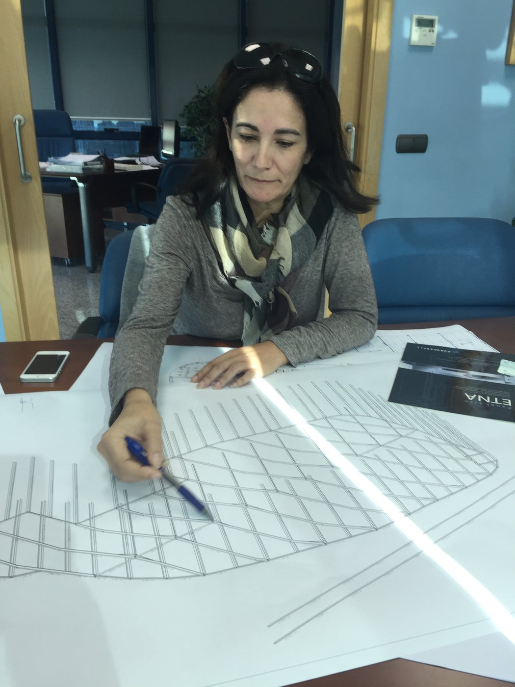 Calero & Cuevas team reviewing a structural drawing