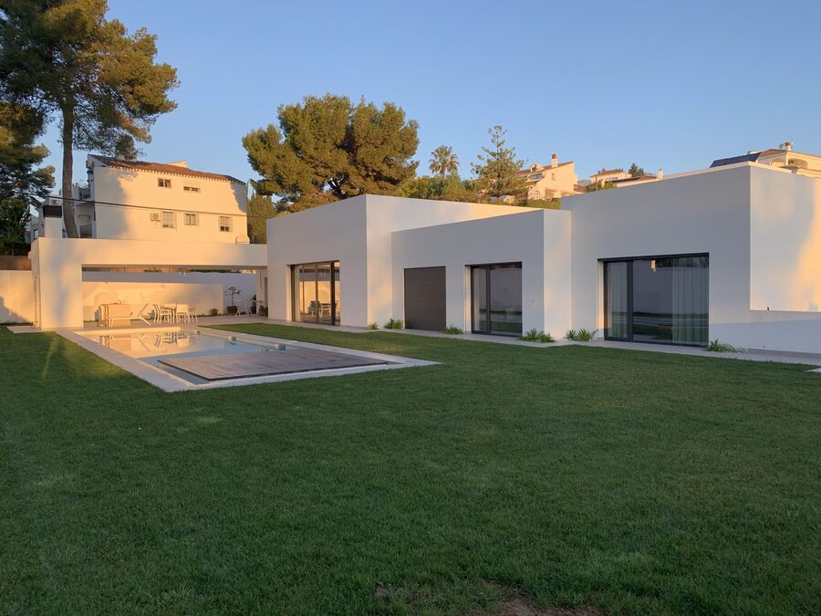 Detached single-family home in Mijas — facade, garden and pool at sunset