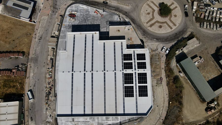 65 kWp industrial solar installation — aerial view of the roof with solar panels